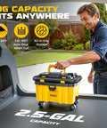 Man placing Cordless 2.5 Gallon Wet Dry Shop Vacuum With 15KPa Suction in car trunk highlighting size and versatility