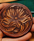 Close-up view of a handcrafted leather design with floral and wave patterns using Leather Beveler Stamp Set for Leather Crafting Pro Grade Smooth Beveling Tools 304 Stainless Steel Stamps DIY Carving Kit 4 Pcs Beginner Friendly Everyday Use.