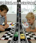 Two kids playing with Ultra Long 16.4-Foot Flexible Race Track For Kids 3 And Up, Dual Lane Roll-Up Set indoors.