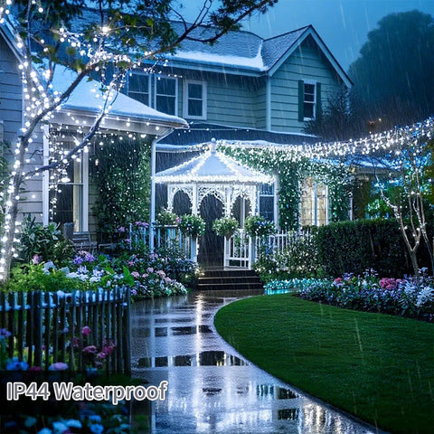 Ultra Long 403 Ft 1000 LED Outdoor Christmas Lights 8 Modes Waterproof Plug In with Timer illuminating a house facade in rain.