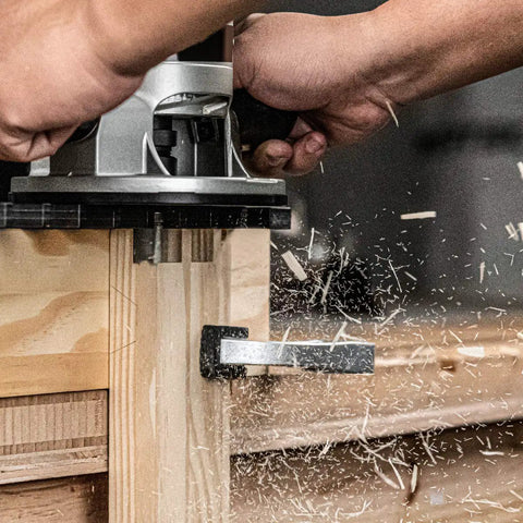 Hands using 15 Inch Dovetail Jig System With Template, Straight Edge Router Bit, 7 Degree Dovetail Bit And Mounting Hardware