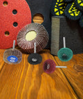 Go-To 50-Piece Double Layer Flap Sanding Wheel Set For Drill displayed on wooden surface with sanding discs and gloves