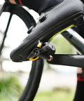 Cyclist using Assioma PRO RS-2 Dual Sensing Pedal Based SPD SL Road Power Meter With Bluetooth and ANT+ Connectivity