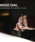 Hand adjusting mode dial on PL500 Penlight 500 Lumens, Five Modes, Rechargeable Mini LED Flashlight With Magnetic Base And Pocket Clip.