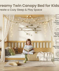 Twin Size Canopy Bed Frame With Four Posters And High Guardrails For Kids Montessori Floor Bed Natural Wood cozy setup with lights, curtains, and child reading.