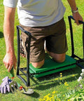 Man using 2-In-1 Garden Kneeler Seat With Tool Bags, Portable Stool And Kneeling Bench Flip Over Design For Weeding And Pruning