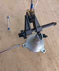 Pro Grade Junior Miniature Vise With One Knob Head Control for Three Plane Movement mounted on workbench in use