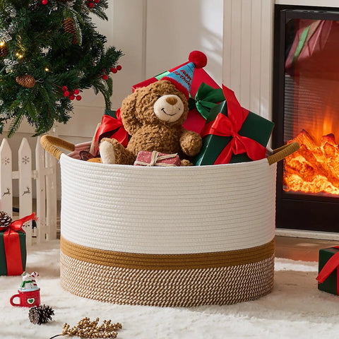 Large Cotton Rope Blanket Basket For Nursery And Living Room Storage Woven Laundry Hamper And Toy Chest 20 By 13 Inches White And Brown with toys inside by fireplace and Christmas tree.