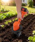 Person using Cordless Mini Tiller With Five 1500mAh Batteries And Fast Charger, 235RPM Handheld Cultivator in garden