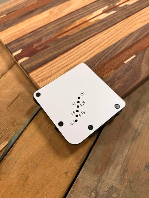 Must Have Cutting Board Foot Jig For Woodworking That Delivers Fast Precise Marking Drilling Or Punching One Eighth Inch Holes With A Heavy Duty 7mm Phenolic Locating Plate Built To Last shown on a wooden surface