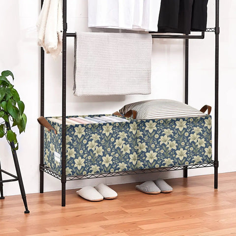 Game Changer Foldable Storage Bins For Shelves With Heavy Duty Steel Frame And Smooth Polyester Fabric Featuring Grab Handles Decorative Floral Organizers For Mess Free Home Organization in a shelving unit with pillows and blankets.