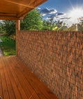 Brown 6 Ft Reed Fencing Roll 16.4 Ft Long Outdoor Privacy Screen on patio blocking sun