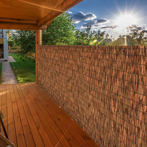 Brown 6 Ft Reed Fencing Roll 16.4 Ft Long Outdoor Privacy Screen on patio blocking sun