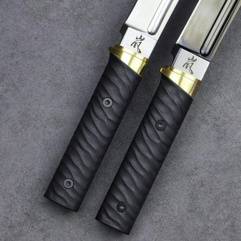 Close view of Tactical Wakizashi Full Tang Fixed Blade Knife, G10 handle, brass guard, Sleipner steel blade with markings.