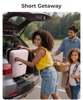 Side view of BAGSMART 20-inch pink hard-shell carry-on luggage with spinner wheels being loaded into a car trunk.
