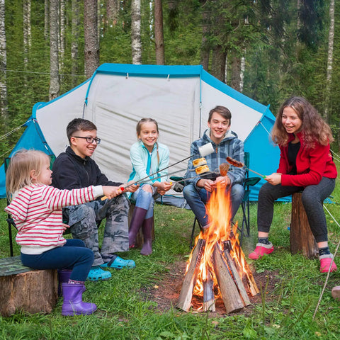 Group of people around campfire using 32 Inch Telescoping Marshmallow Roasting Sticks Set For Campfire Open Fire Pit S'mores Skewers