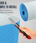 Solid Uncoupling Membrane Roll For Tile Underlayment Spanning 150 Square Feet, cut with knife for easy installation.