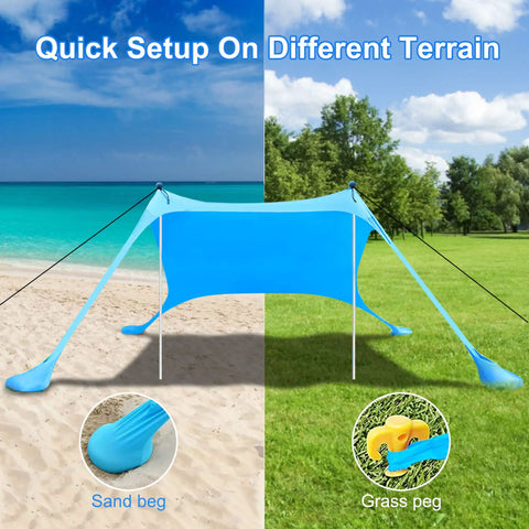 Sun Shield Beach Canopy Tent With UPF 50 Plus Protection set up on sand and grass, sandbags and grass pegs visible