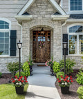 Front view of house with two Solar Post Light With Planter 64 Inch Outdoor Garden Lamp For Backyard Pathway Patio And Front Door