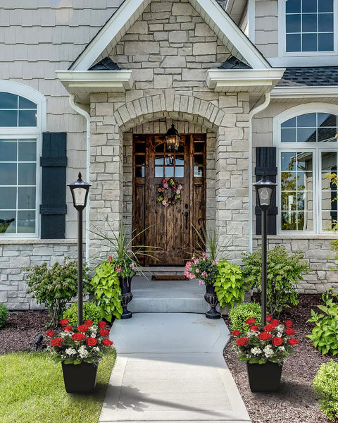 Front view of house with two Solar Post Light With Planter 64 Inch Outdoor Garden Lamp For Backyard Pathway Patio And Front Door