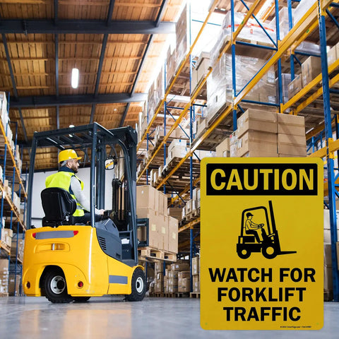 Built Like A Tank Heavy Duty Caution Watch For Forklift Traffic Safety Sign Rust Resistant Outdoor Aluminum Warning Plaque Easy Screw Mounting in an active warehouse.