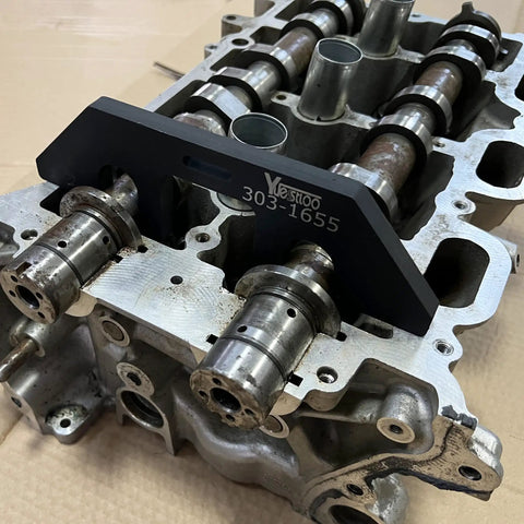 Close-up of camshaft with Camshaft Holding And Timing Alignment Tool Kit Pro Grade For Ford 3.5L EcoBoost installed.