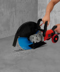14 Inch Electric Concrete Saw and Wall Grooving Machine with Slick Rolling Base and Water System for Zero Dust 4000W 3000 RPM cutting through concrete with water spray.