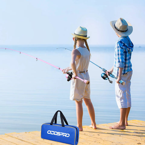Kids with fishing rods by lake, showcasing the Kids Fishing Pole Starter Kit With Tackle Box Reel Practice Plug Beginner Guide And Travel Bag 2 Pack In Blue And Light Pink 1.5M 4.92Ft For Boys And Girls.