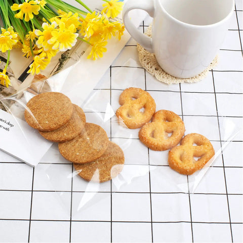 300 Count 4x6 Inch Self Adhesive Cellophane Bags 2.8 Mil Clear Plastic Bags with Cookies and Pretzels Displayed