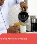 Person pouring coffee using 12 Cup Thermal Programmable Coffee Maker With Brew Strength And Vortex Technology, Black And Steel Finish, Four Layer Vacuum Carafe Keeps Your Java Hot For Hours, Auto Shutoff, 24 Hour Programmable Brew, No Warming Plate Needed