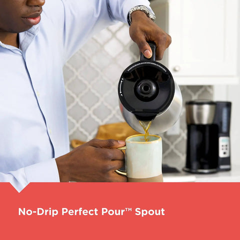 Person pouring coffee using 12 Cup Thermal Programmable Coffee Maker With Brew Strength And Vortex Technology, Black And Steel Finish, Four Layer Vacuum Carafe Keeps Your Java Hot For Hours, Auto Shutoff, 24 Hour Programmable Brew, No Warming Plate Needed