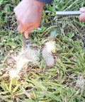 Person using 3/8 Inch By 4 Inch Drilled Survival Ferro Rod Flint Fire Starter With Toggle Lanyard Hole for campfire ignition