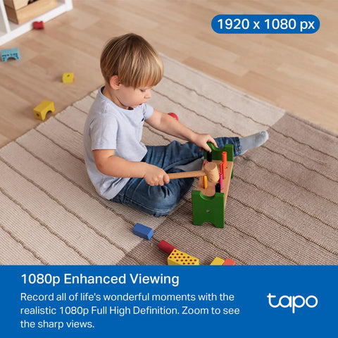 Child playing on a carpeted floor with toys, captured by 1080P Indoor Pan Tilt Security Camera Plug And Play For Home Surveillance C201.