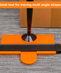 10 Inch Contour Gauge Duplicator With Lock for Quick Layouts and Precise Fitting on a table with a metal pipe.