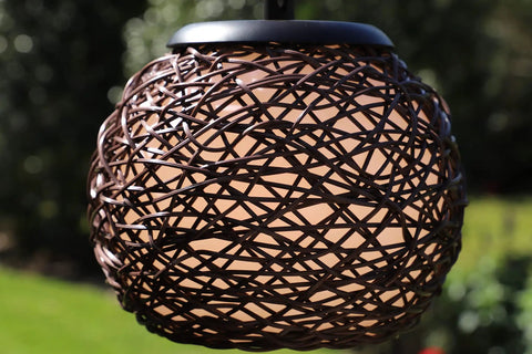 Close-up of the woven rattan shade on the Castillo Outdoor Table Lamp in Oil Rubbed Bronze
