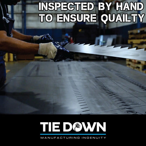 Metal Landscaping Edging being hand-inspected for quality in a manufacturing facility.
