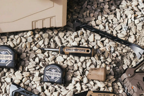 Built Tough Multi Bit Screwdriver Featuring Double Sided Magnetized Tips And Ergonomic MOA Grip on gravel with tools.