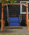 Cozy Navy Rattan Patio Swing Chair For One With Cushions, Heavy Duty Metal Frame And Sturdy Hanging Ropes in a garden setup