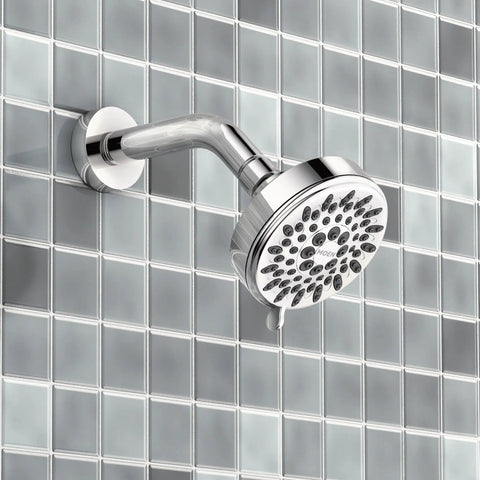 Ignite Chrome Five Function Shower Head With 2.5 GPM High Pressure Spray and customizable modes on tiled wall