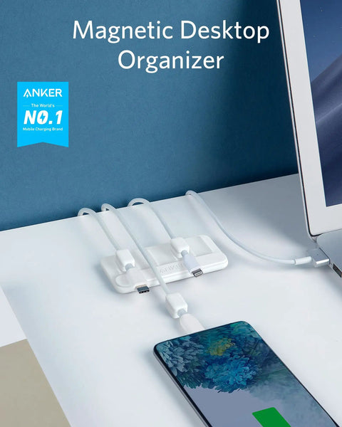 Magnetic Cable Organizer With Five Clips For Lightning USB C Micro USB And Other Wires on a desk with phone and laptop