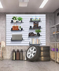 Installed Heavy Duty Slatwall Shelves 16 Inch Wide Wire Shelf Organizer For Garage Workshop Kitchen And Office Slatwall Accessories Durable Powder Coated Finish 2 Pack with items displayed on shelves.