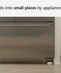 WiFi Water Leak Detector and Freeze Alarm with Alexa Compatibility placed near kitchen appliance