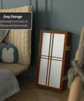 Grab-And-Go Walnut 2 Ft Desktop Double Cross Shoji Screen folded next to chair, 6-panel privacy divider with rice paper