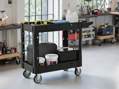 Heavy Duty Two Tier Rolling Utility Cart Built Like A Tank With Super Smooth Locking Casters holds tools and supplies in garage.