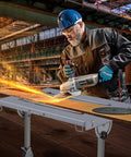 Man using Built Tough Folding Welding Table 44 By 21 Inches Heavy Duty Steel Workbench for metalwork.