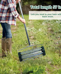 Person using Heavy Duty Rolling Lawn Aerator With 1.4 Inch Spikes And 57 Inch Steel Handle on grassy area