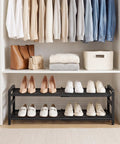 Rock Solid Expandable Shoe Rack Black Two Tier Metal Closet Organizer Holds Eight Pairs Of Sneakers in tidy closet setup.