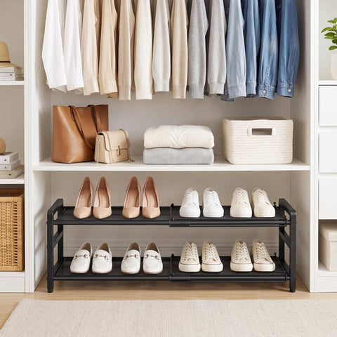 Rock Solid Expandable Shoe Rack Black Two Tier Metal Closet Organizer Holds Eight Pairs Of Sneakers in tidy closet setup.