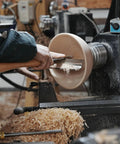 Heavy Duty 1 Inch Diameter Woodturning Lathe Tool Rest Set in use, shaping wooden bowl with streamlined control and wood shavings.
