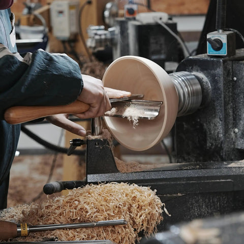 Heavy Duty 1 Inch Diameter Woodturning Lathe Tool Rest Set in use, shaping wooden bowl with streamlined control and wood shavings.